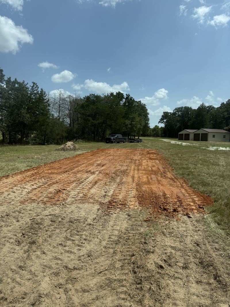 Building a pad up out of clay on open acreage